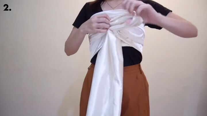 how to make an easy diy o ring top you can wear 6 different ways, Crossing and looping the fabric