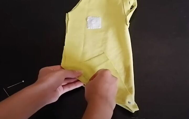 how to make a halter top out of a polo shirt 2 different ways, Checking the hem for symmetry