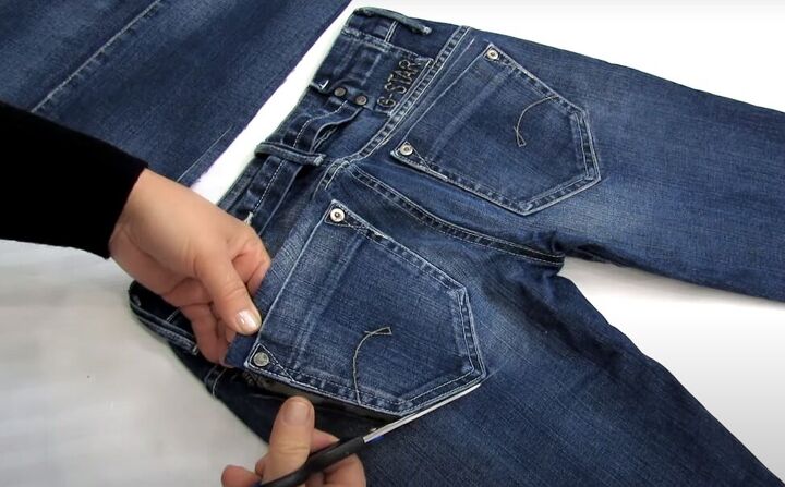 how to make a diy denim tote bag in 3 simple steps, Cutting off the pockets from the jeans