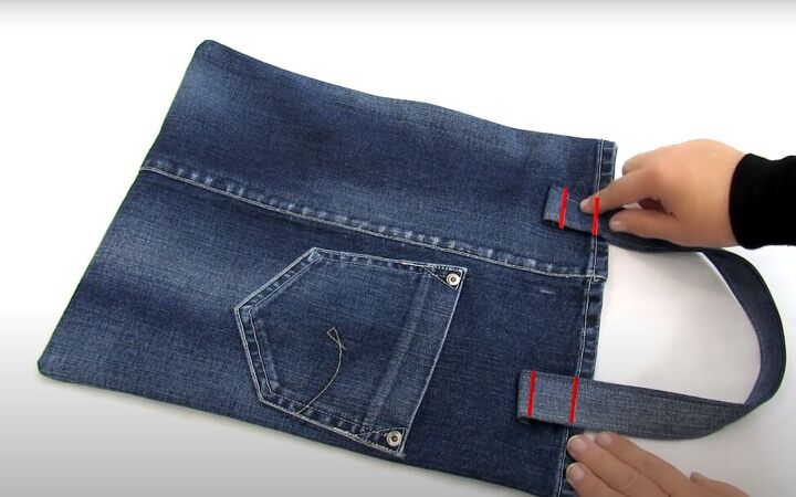 how to make a diy denim tote bag in 3 simple steps, Topstitching the handles to the bag