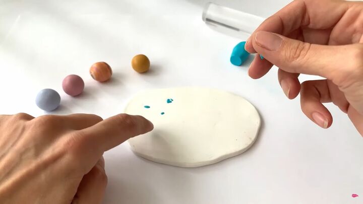 5 quick easy diy polymer clay earring ideas for beginners, Breaking off small pieces of colored polymer clay and adding them to the slab