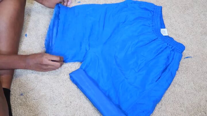 how to make an easy diy two piece short set out of old sweatpants, Rolling up the ends of the shorts