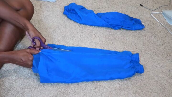 how to make an easy diy two piece short set out of old sweatpants, Cutting the side seams of the pant legs
