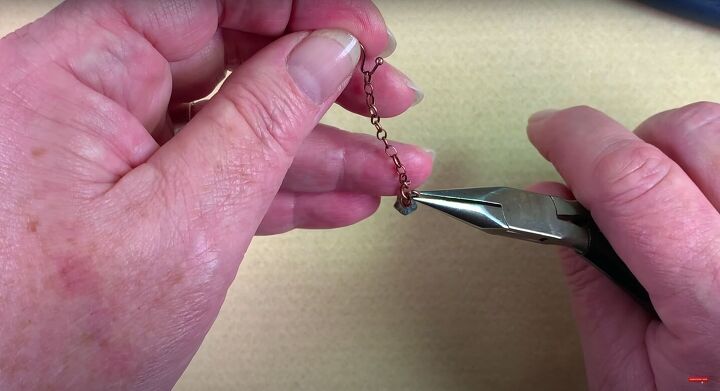 how to make dangle earrings with adorable bellflower oak leaf beads, Adding the bellflower beads onto the jump ring