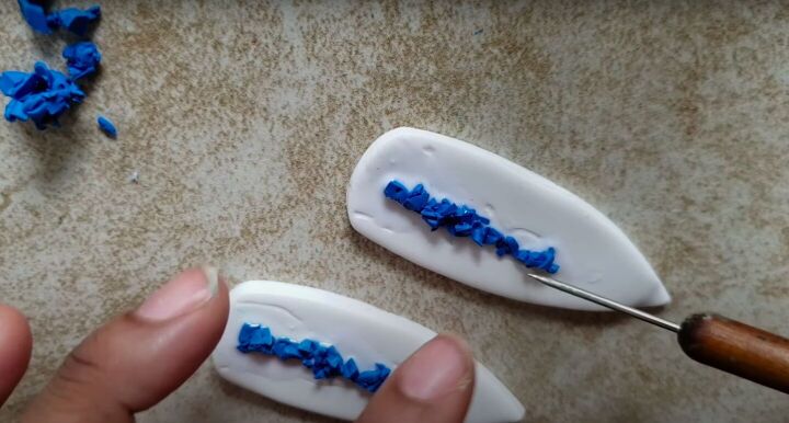 need some faux crystal earrings try this polymer clay geode tutorial, Adding a line of color in the center