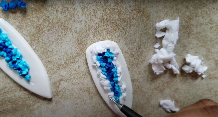need some faux crystal earrings try this polymer clay geode tutorial, Adding the translucent clay to the geode design