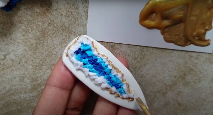 need some faux crystal earrings try this polymer clay geode tutorial, Painting gold around the geode shape
