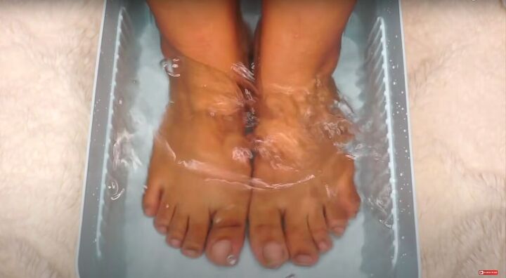 how to do an at home pedicure to get your feet ready for summer, Soaking feet in lukewarm soapy water