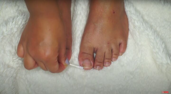 how to do an at home pedicure to get your feet ready for summer, Removing leftover nail polish with a q tip