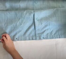 how to make a long diy button down skirt out of an old men s shirt, Pinning the bottom of the shirt closed