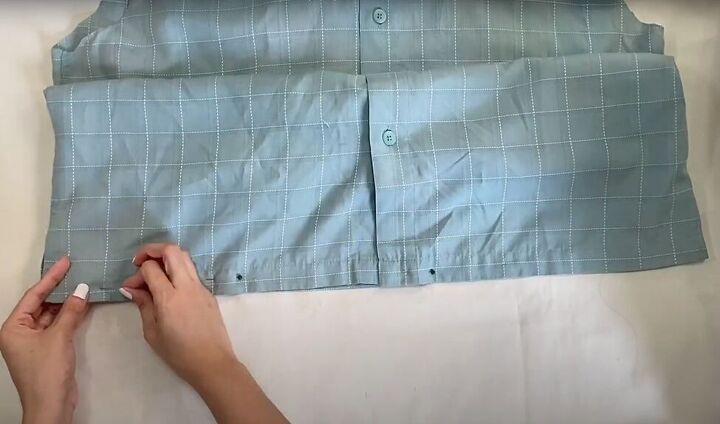 how to make a long diy button down skirt out of an old men s shirt, Pinning the bottom of the shirt closed