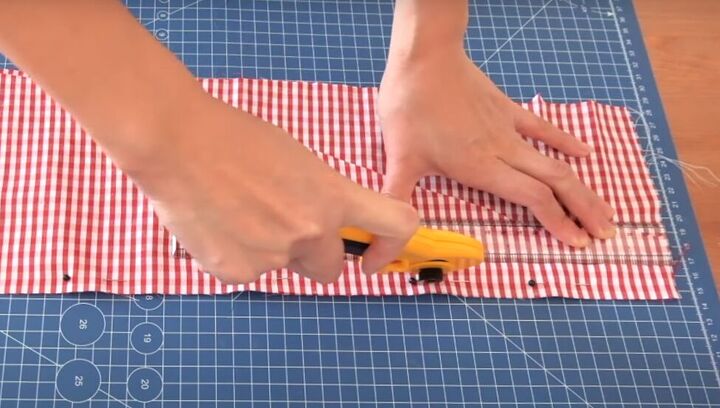 how to turn a skirt into a crop top in 7 simple steps, Cutting off a 1 inch strip of fabric