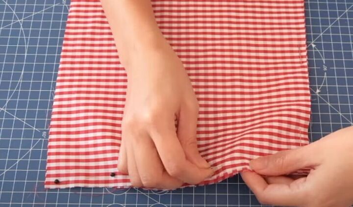 how to turn a skirt into a crop top in 7 simple steps, Pinning the edge of the fabric