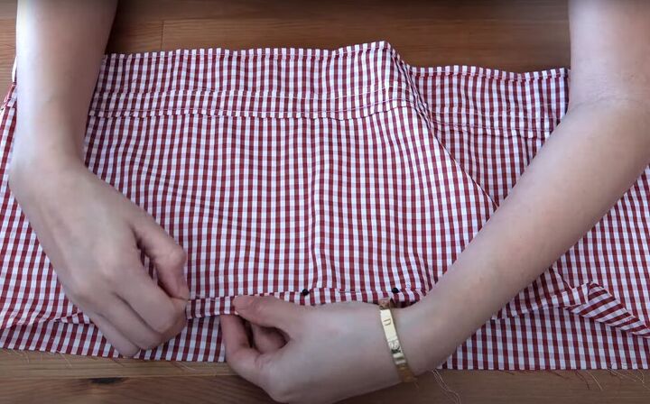 how to turn a skirt into a crop top in 7 simple steps, Folding and pinning the edges