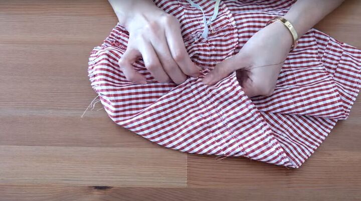 how to turn a skirt into a crop top in 7 simple steps, Pulling elastic through the elastic casing