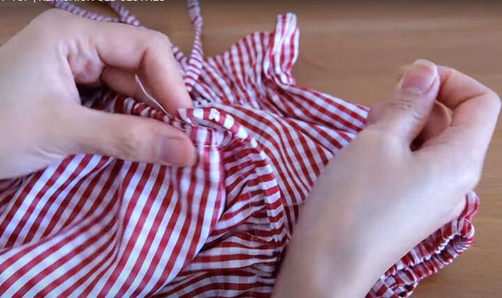 how to turn a skirt into a crop top in 7 simple steps, Hand sewing the ties in place
