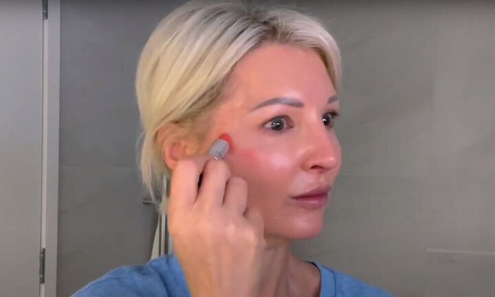 want an everyday glow try this natural makeup tutorial for over 50s, Applying lipstick to cheeks instead of blush