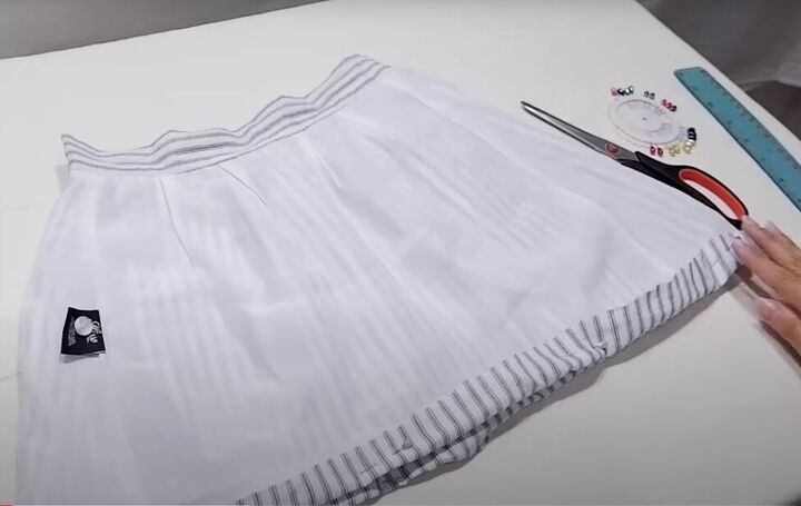 how to make a diy halter top mini skirt out of an old midi skirt, Hemming the mini skirt