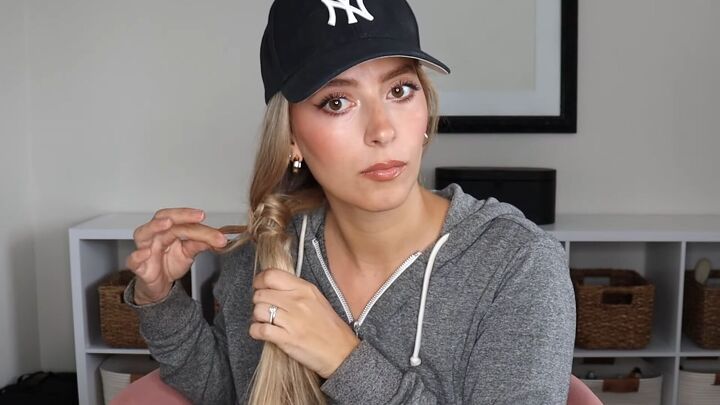 4 easy unique ways to wear a baseball cap with braids, Adding in more hair to the strand and continuing to wrap