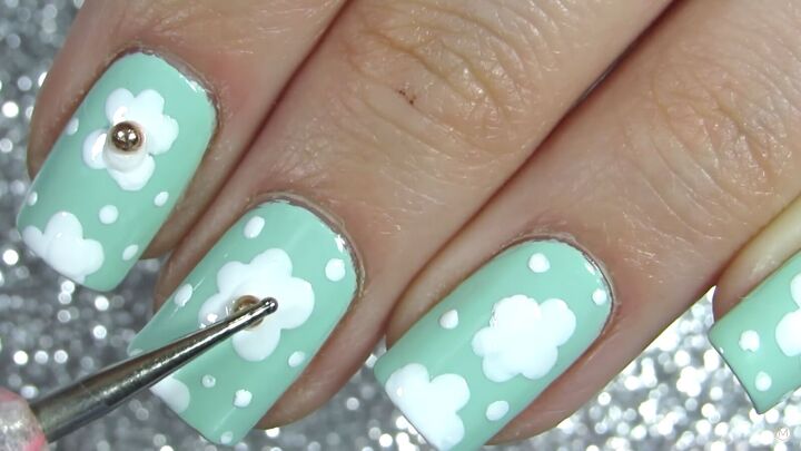 how to do adorable daisy nails for spring in 5 easy steps, Using a dotting tool to apply the nail stud