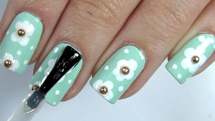 how to do adorable daisy nails for spring in 5 easy steps, Finishing the spring nails with a clear top coat