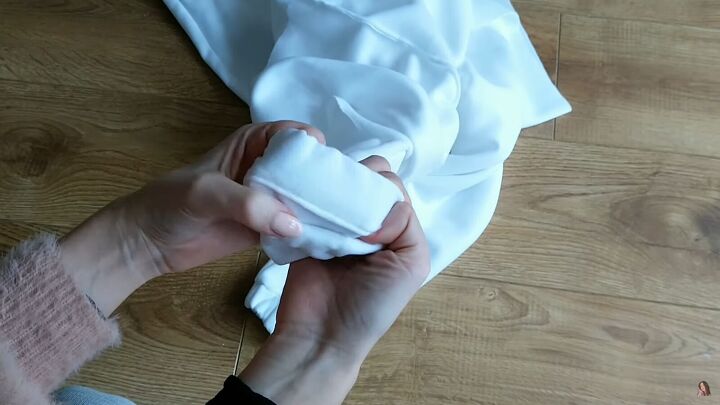 how to make your own zip up hoodie from scratch, Folding the fabric over the cuffs
