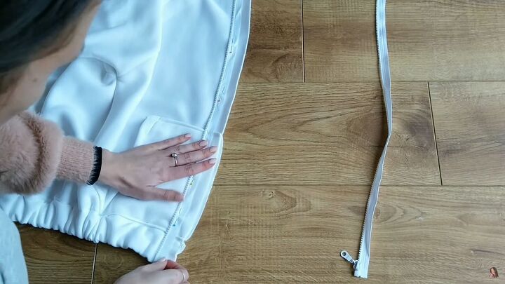 how to make your own zip up hoodie from scratch, Sewing the zipper onto the hoodie
