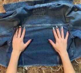 how to upcycle a denim jacket easily using an old graphic tee, Laying the back panel of the denim jacket flat