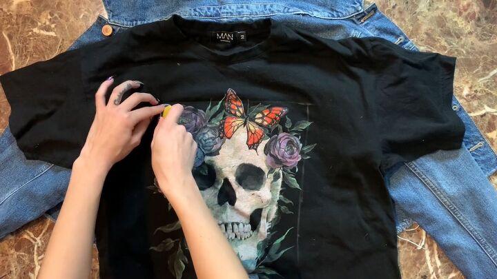 how to upcycle a denim jacket easily using an old graphic tee, Tracing the back panel