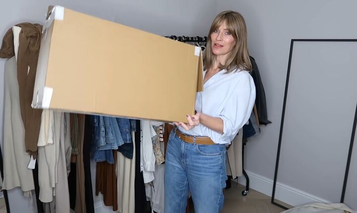 how to declutter your closet 10 helpful tips for spring cleaning, Packing out of season clothes in boxes