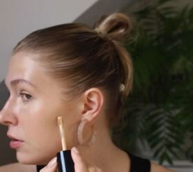 how to create a glowy bronze makeup look for spring summer, Adding concealer to any blemishes