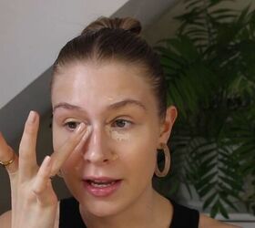 how to create a glowy bronze makeup look for spring summer, Blending under eye concealer with ring finger