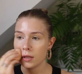 how to create a glowy bronze makeup look for spring summer, Blending concealer with a makeup sponge