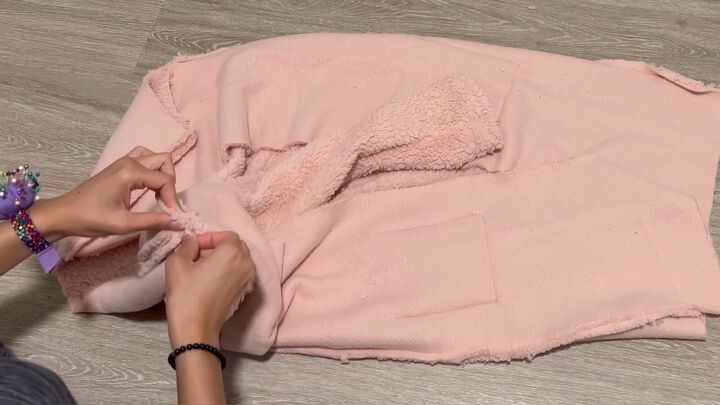 how to make a cozy sherpa robe out of a 5 walmart blanket, Inserting the sleeves into the armholes