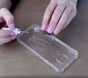 how to easily make a pretty pressed flower phone case for spring, Pouring clear nail polish into the phone case