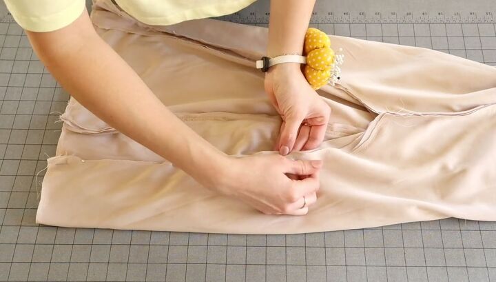 how to easily turn an old bridesmaid dress into a jumpsuit, Pinning the crotch seam ready to sew