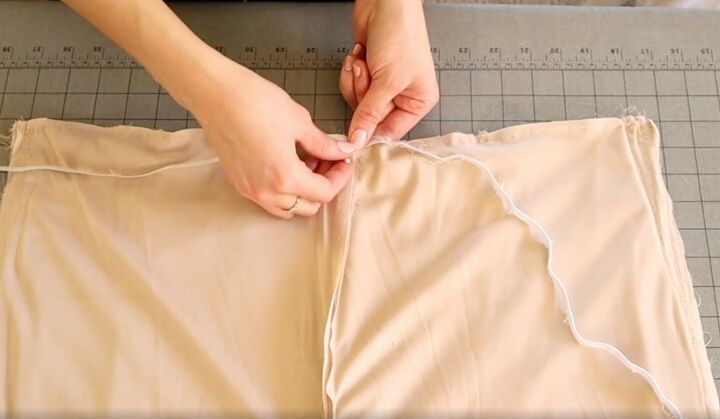 how to easily turn an old bridesmaid dress into a jumpsuit, Pinning the elastic to the waistline