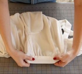 how to make a peasant crop top that s perfect for spring summer, Pinning the waist tie to the DIY peasant crop top