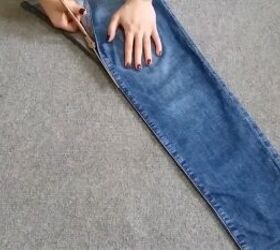 how to make a pretty diy denim top with cute scalloped details, Cutting the jean leg along the side seam