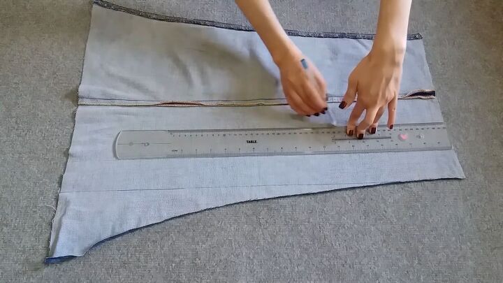 how to make a pretty diy denim top with cute scalloped details, Drawing strips along the pant leg