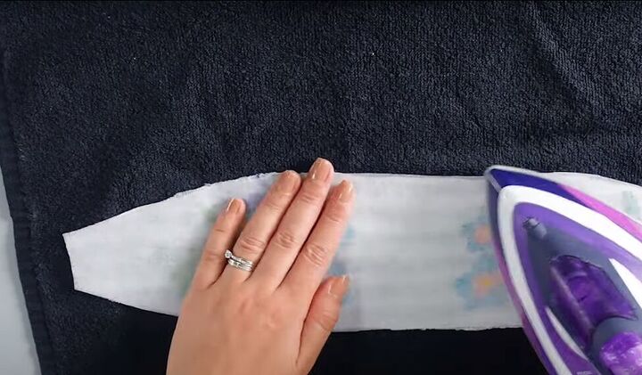 how to turn a plain headband into a cute embroidered hair piece, Ironing interfacing onto the embroidered piece