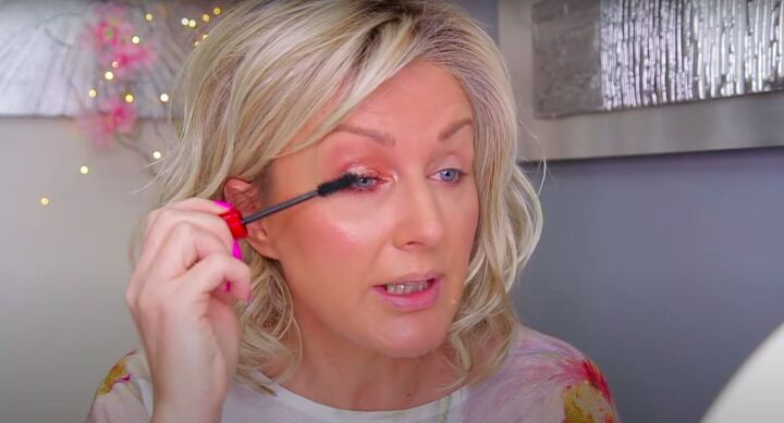 how to do light subtle everyday eye makeup for hooded eyelids, Applying mascara to eyelashes
