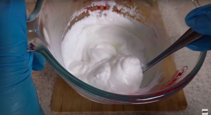 how to make hand lotion that will hydrate moisturize your hands, Stirring the mixture with a spoon