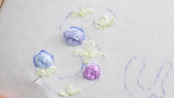 how to embroider a custom t shirt using 4 easy embroidery stitches, Embroidered flowers on a t shirt