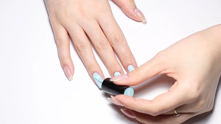 how to put a spin on a classic manicure using a fun french tip hack, Applying colored gel polish to nails