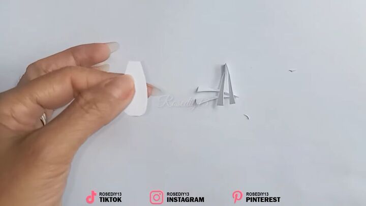 how to make fake nails out of nail polish paper in 7 simple steps, Cutting a nail shape out of paper