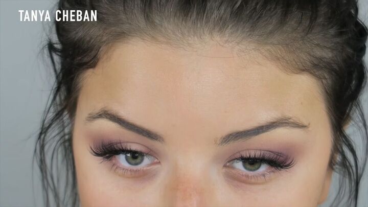 how to do a purple smokey eye for a glam spring summer look, Applying false eyelashes