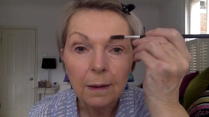 5 minute eye makeup for mature eyes for easy definition, Balancing the eyebrows with a spoolie brush
