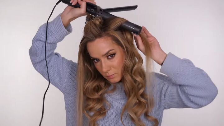 how to curl hair perfectly with a curling iron step by step, Holding the curling iron above the head