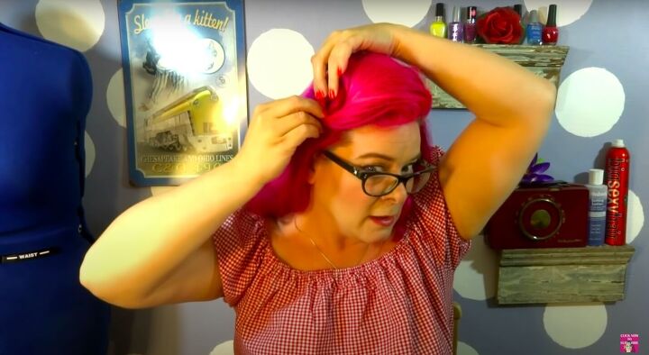 how to do a cute easy rockabilly hairstyle with a bandana, Curling the end of the swoop into a pin curl